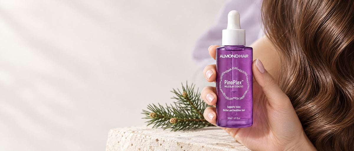 Woman holding Almond Hair PinoPlex hair serum